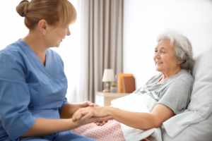 A caregiver taking care a patient