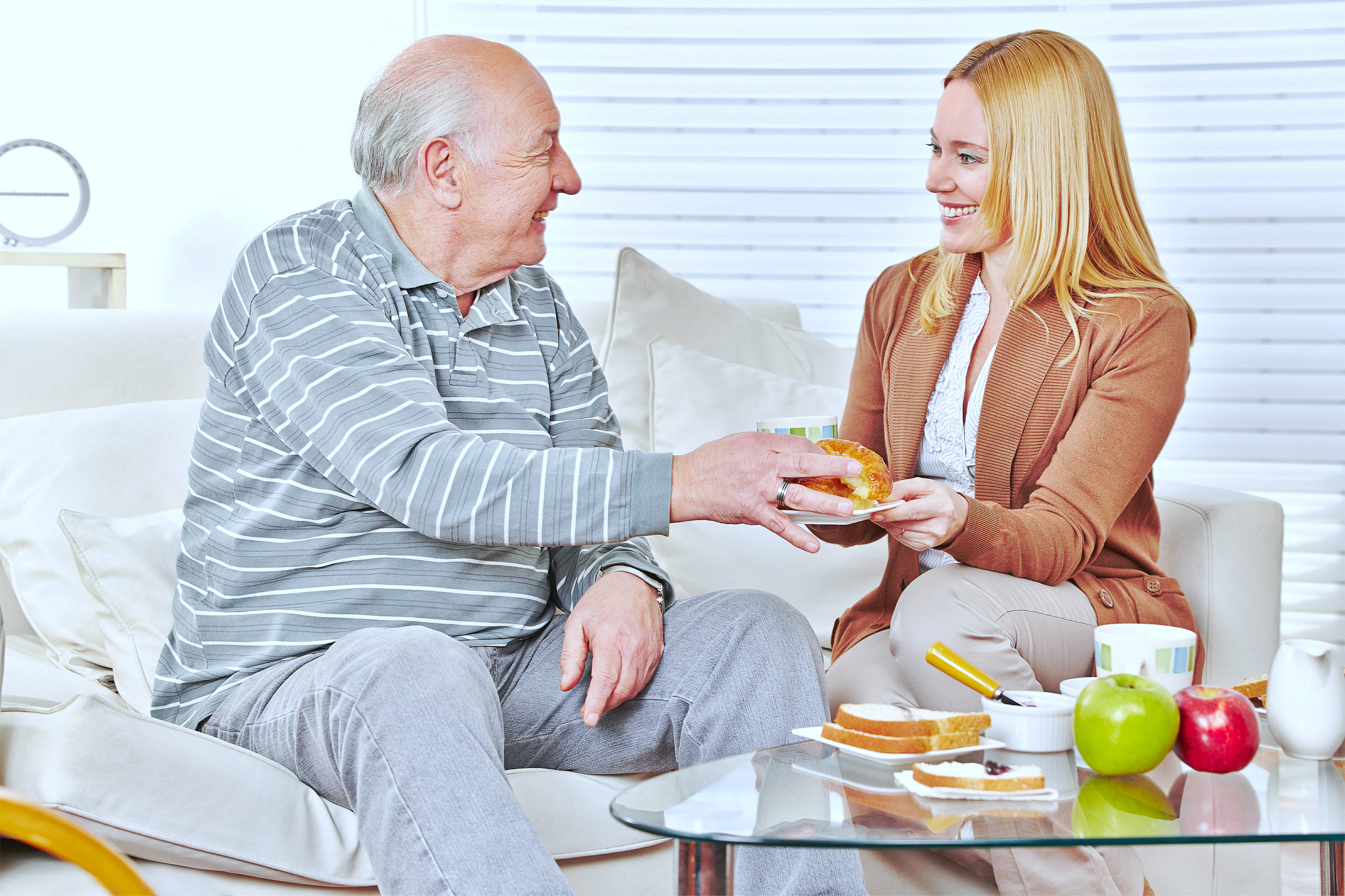 A caregiver giving food to the patient