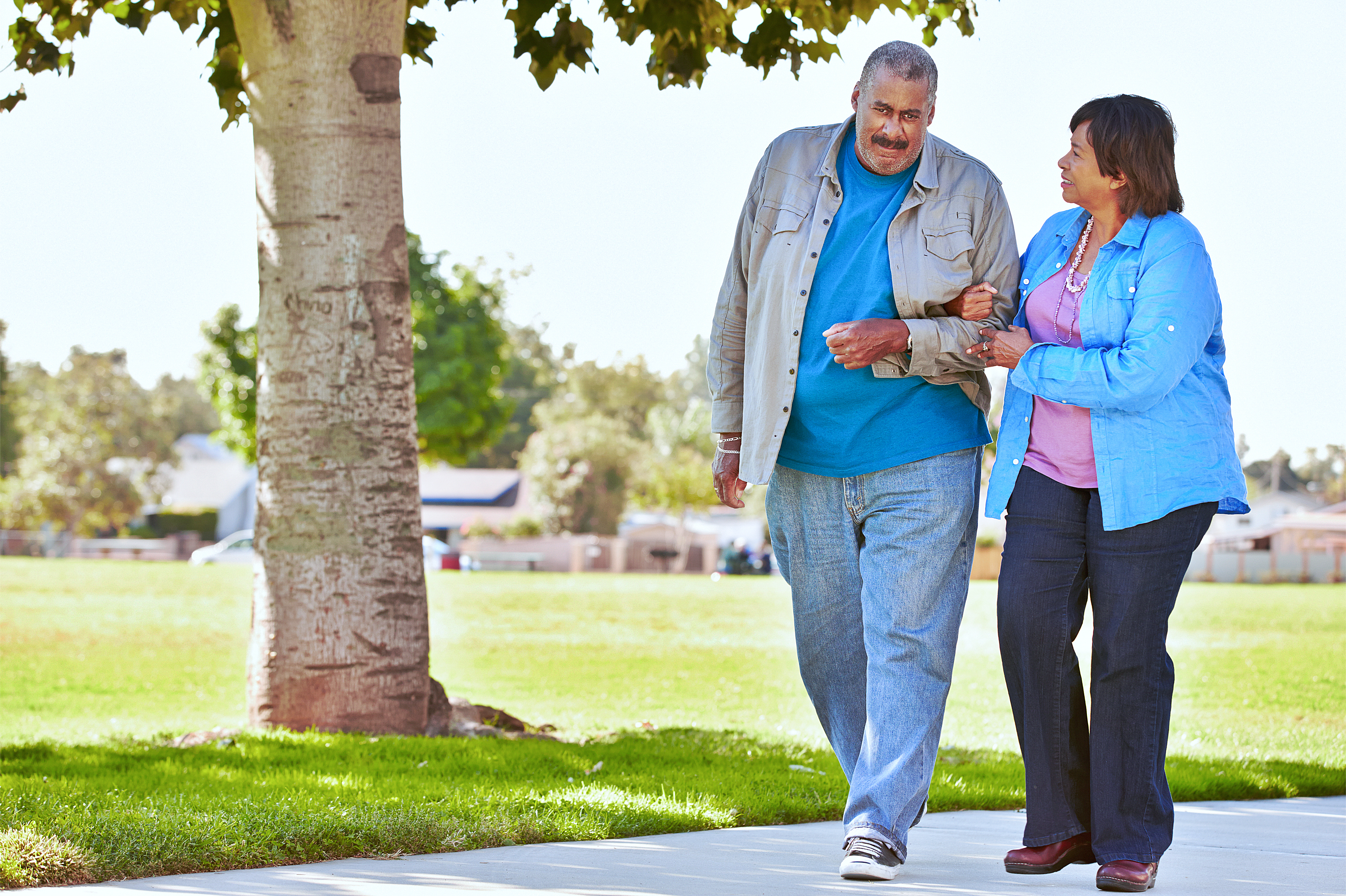A caregiver and a patient walking